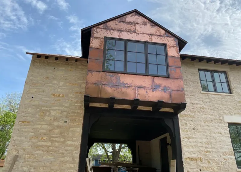 Copper metal panel facade on a stone building for Metal Roof Coating in Fuller Heights