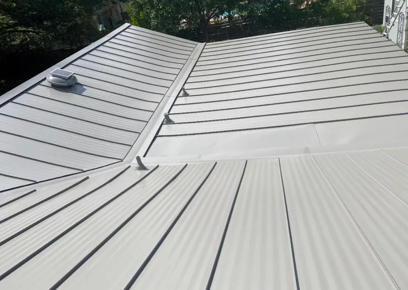 Solar attic fan installed on a metal roof for Roof Ventilation in Fuller Heights